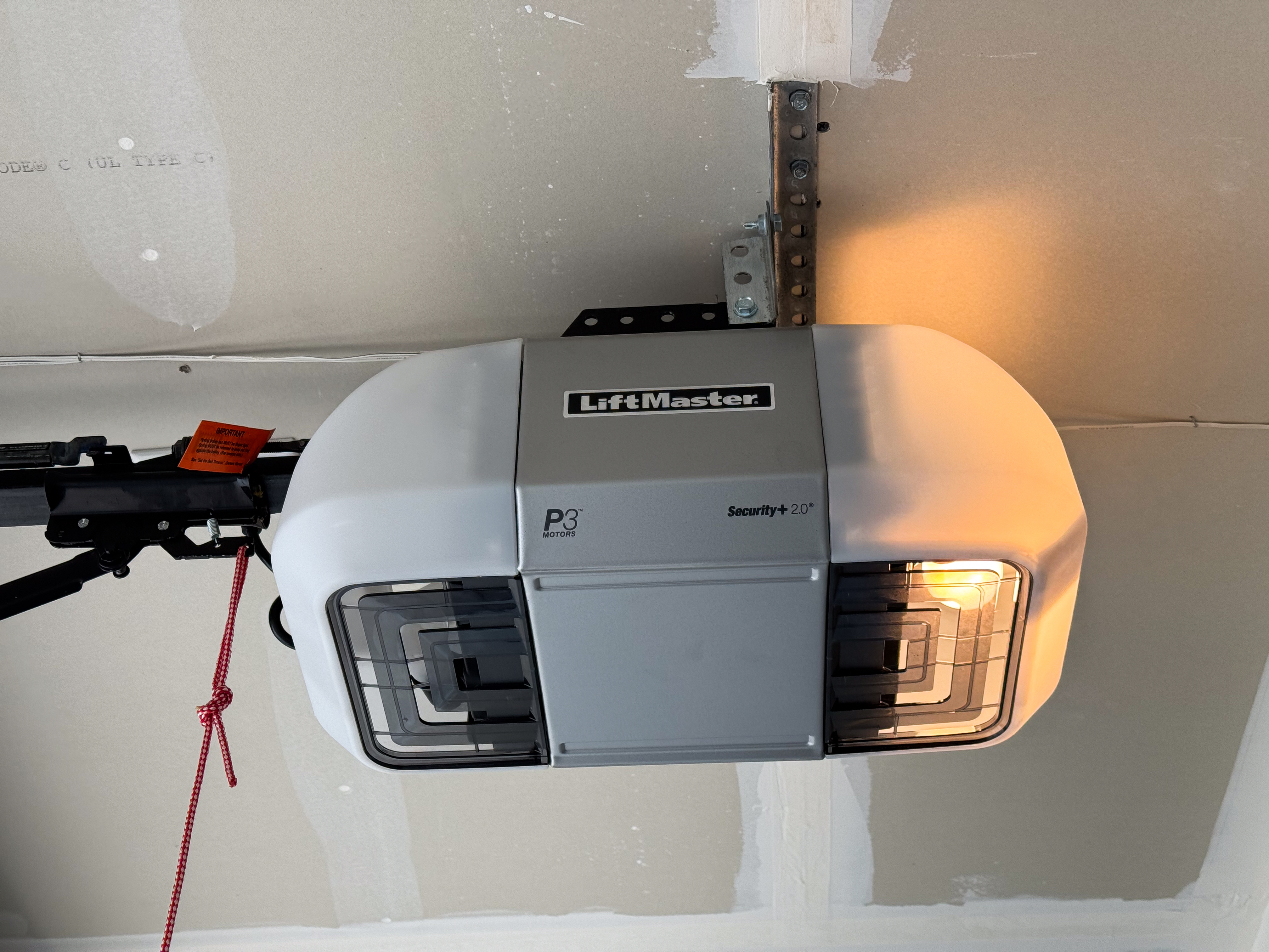 Ceiling-mounted garage door opener motor